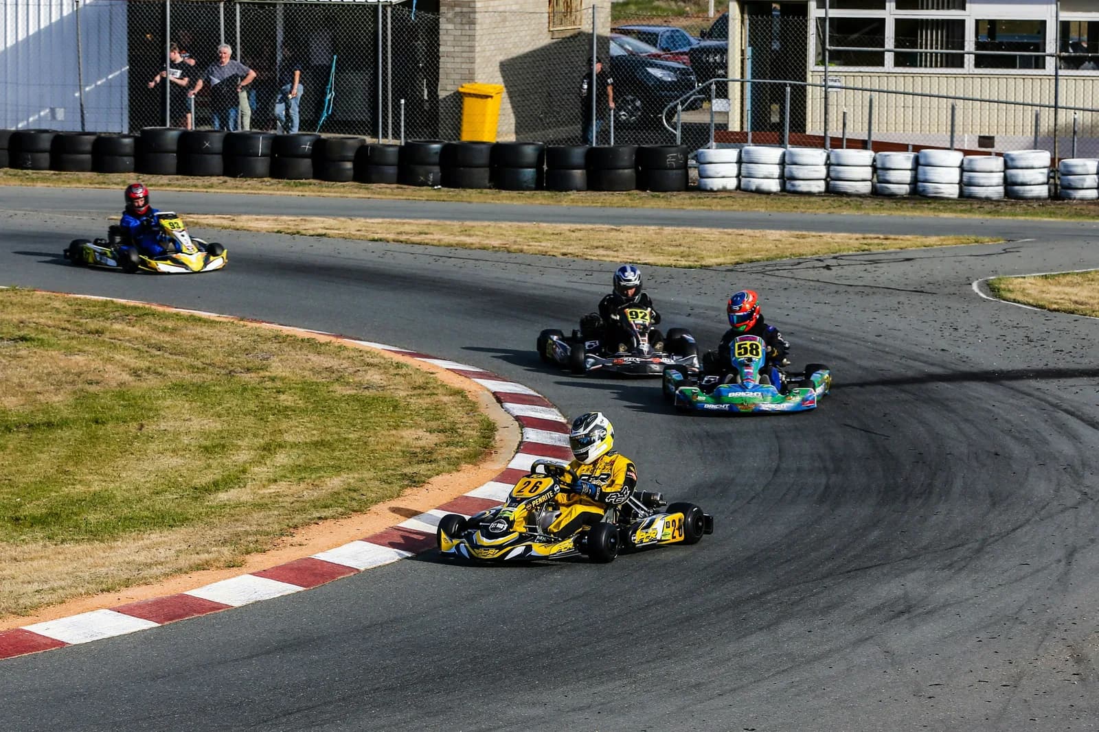 Kart racer reviewing lap timing data between sessions